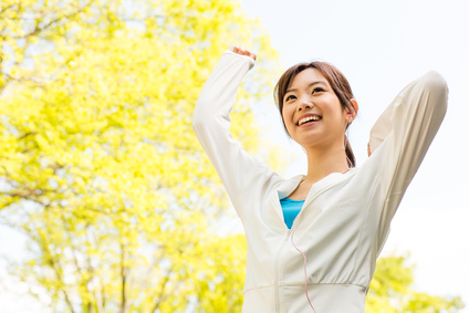 young asian woman relaxing in the park