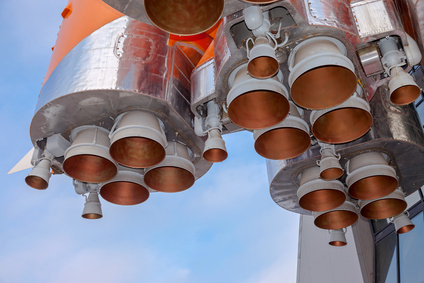 Details of space rocket engine over blue sky background