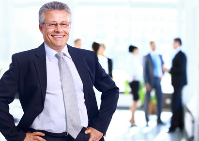 Successful business man standing with his staff